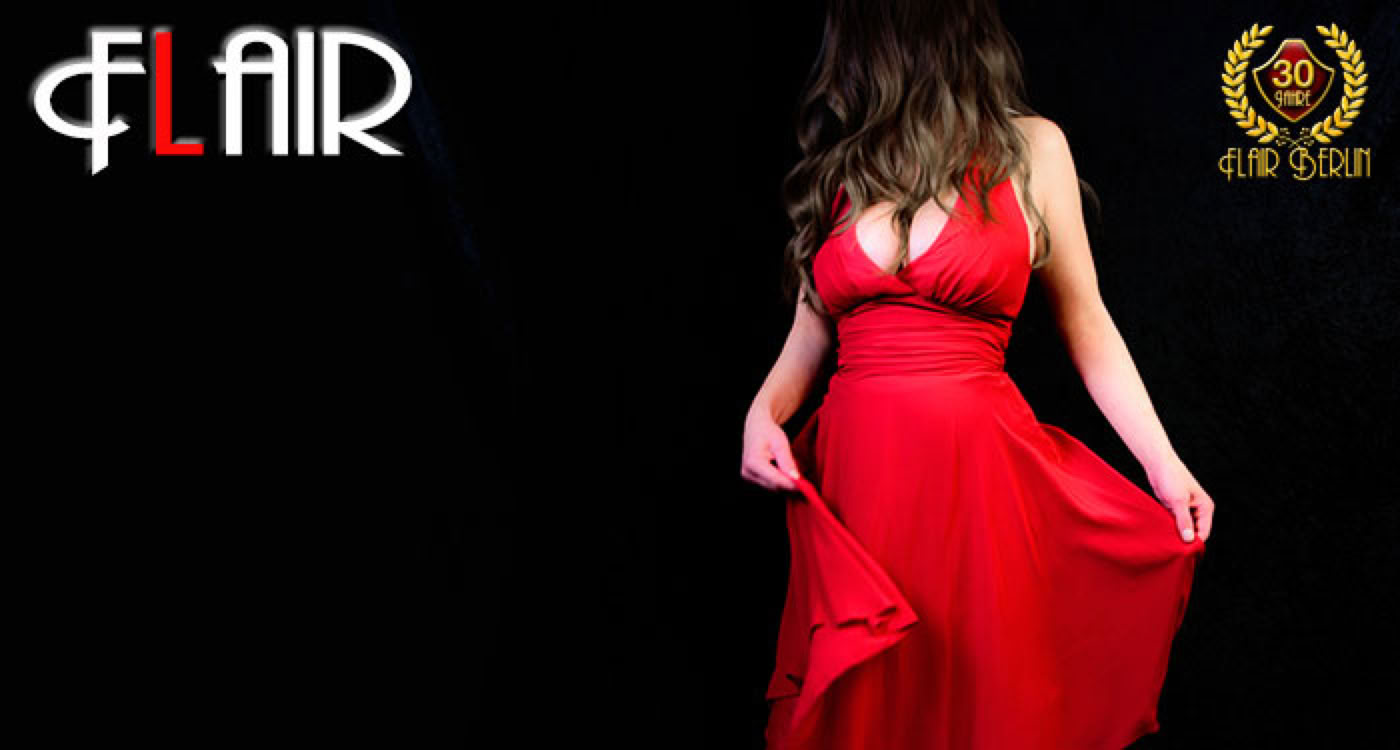 Girls at Flair Brothel Berlin - A person in a red dress holding the sides of the skirt, with the word "FLAIR" and a logo in the background.